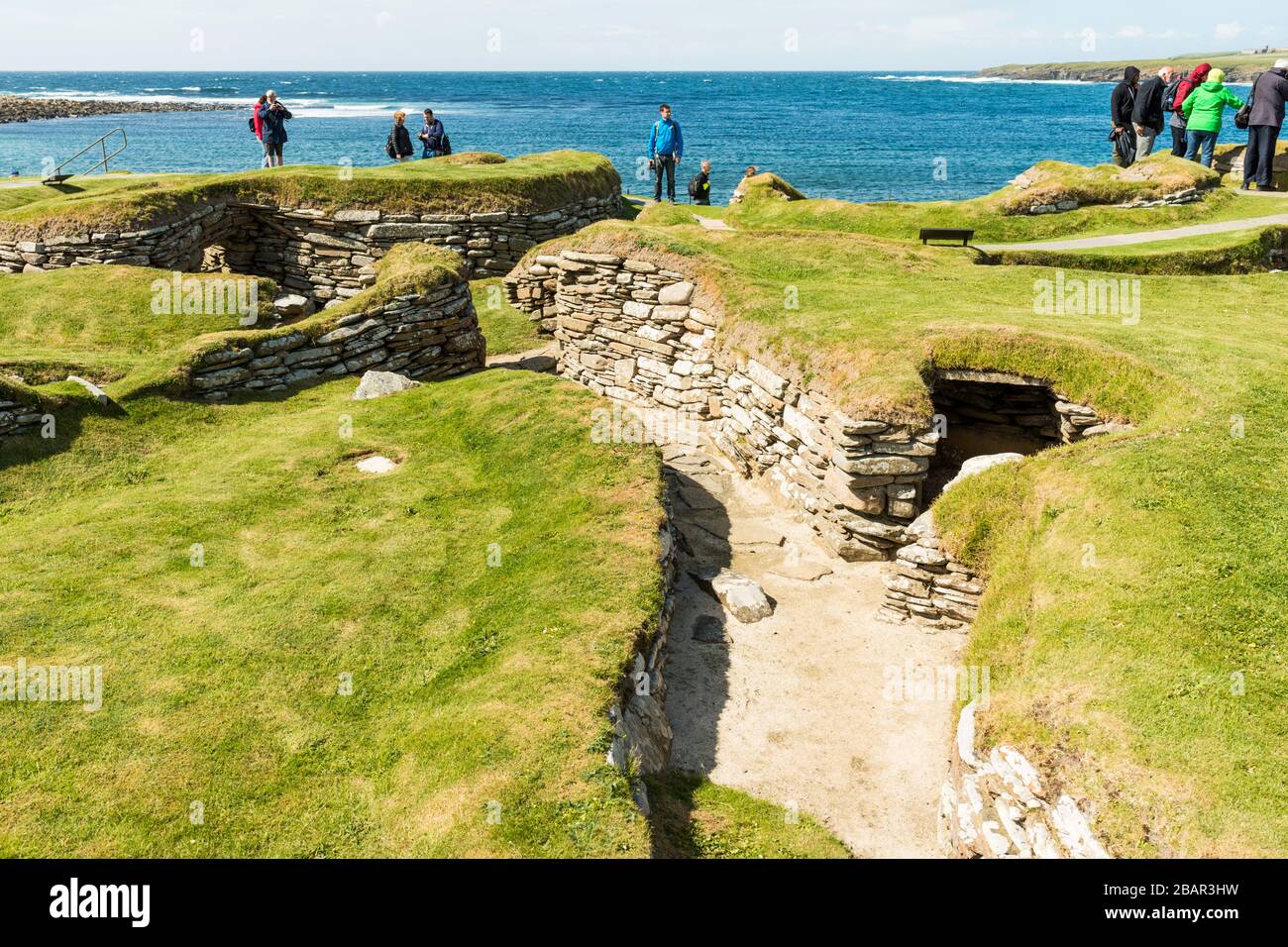 Skara Brae is a Neolithic settlement on the Bay of Skaill, Orkney, Scotland.  It was occupied between 3180 BC and 2500 BC. Stock Photo