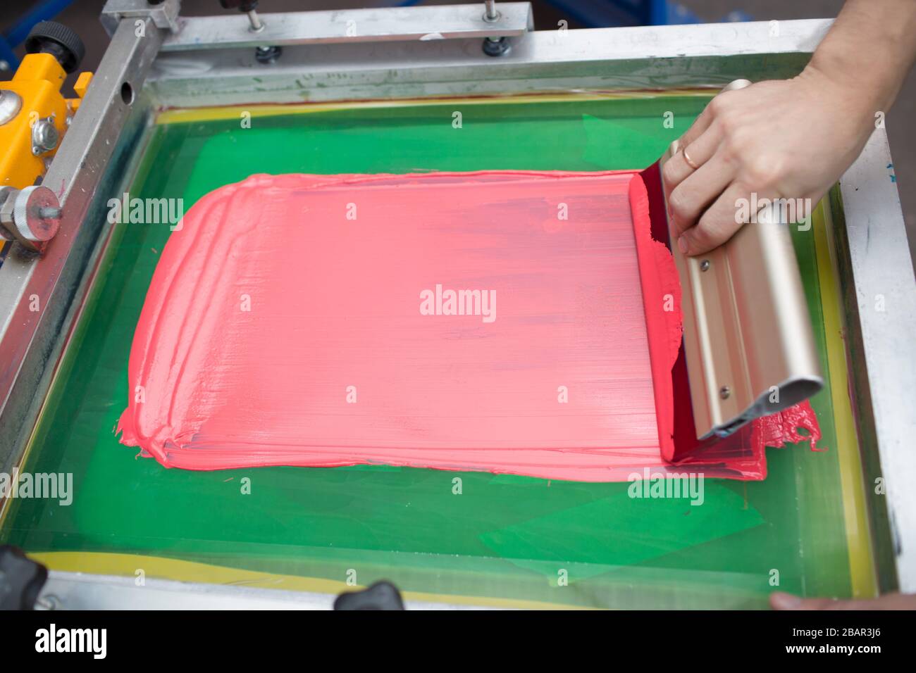 Silk screen printing. Serigraphy. Color paints and fabric. Plastisol