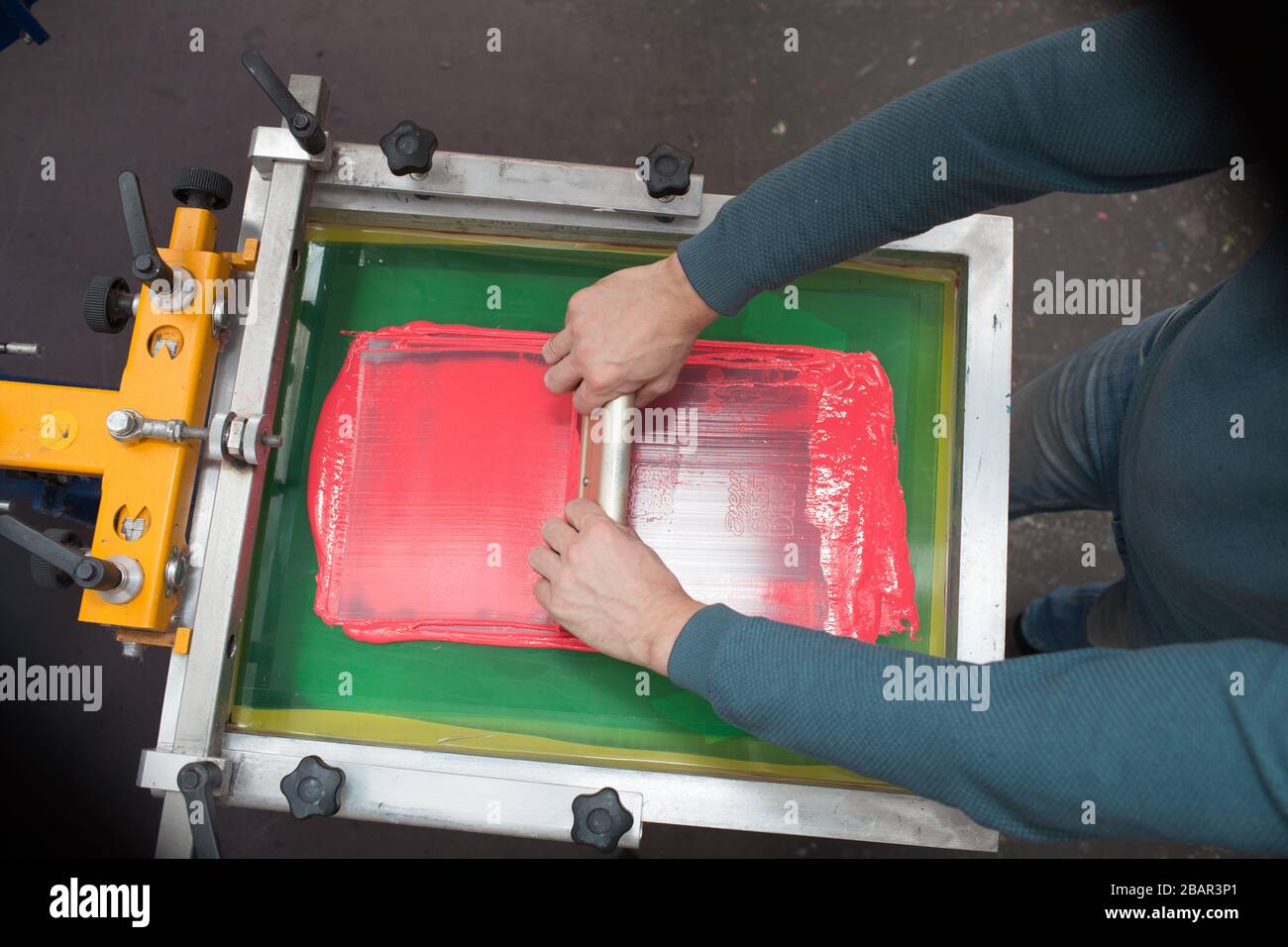 Silk screen printing. Serigraphy. Color paints and fabric. Plastisol