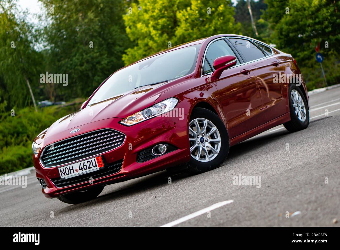 Fil Kalksten Kreta Ford Mondeo MK5 Titanium trim, in Ruby red coloud, sedan, photosession in  an empty parking lot. Isolated car, nice photos Stock Photo - Alamy