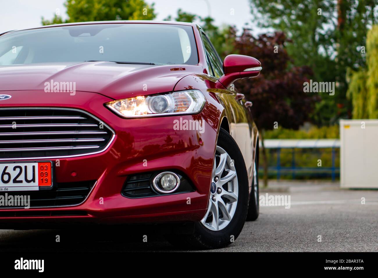 Ford Mondeo MK5 Titanium trim, in Ruby red coloud, sedan, photosession in  an empty parking lot. Isolated car, nice photos Stock Photo - Alamy
