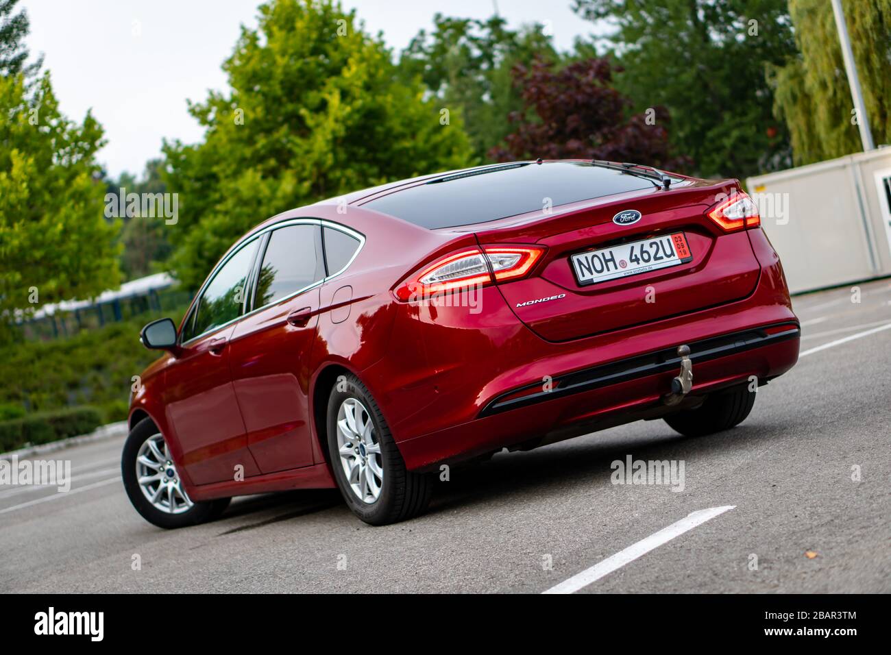 Ford Mondeo MK5 Titanium trim, in Ruby red coloud, sedan, photosession in  an empty parking lot. Isolated car, nice photos Stock Photo - Alamy