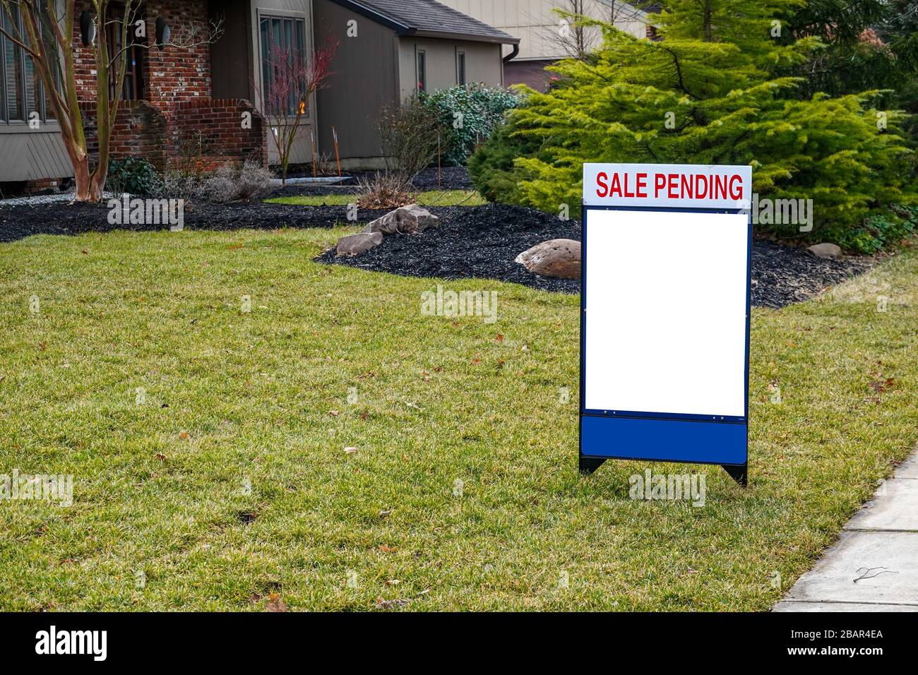 Download Blank White Lawn Sign In The Grass In Front Of A House A Sign On Top Says Sale Pending Stock Photo Alamy
