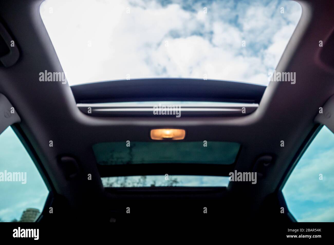 Panoramic view inside car double sunroof hatch with tinted glass