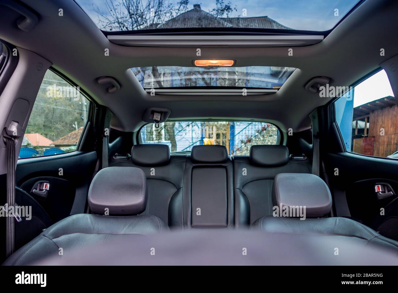 Panoramic view inside car double sunroof hatch with tinted glass