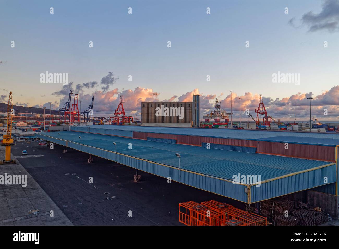 Some of the large modern Warehousing facilities alongside the Quays of Las Palmas Port at dawn. Stock Photo