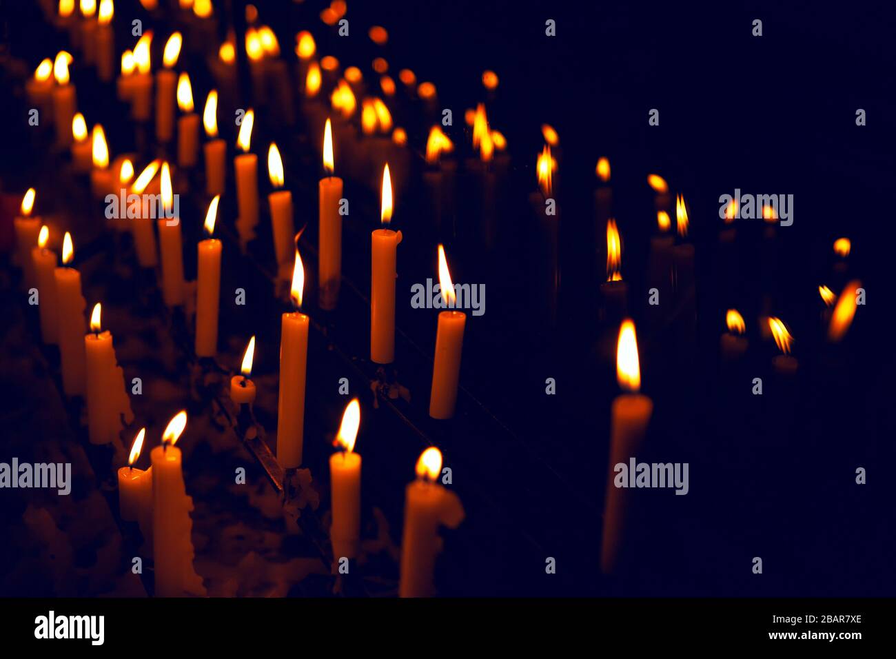 dark background with burning candles Stock Photo - Alamy