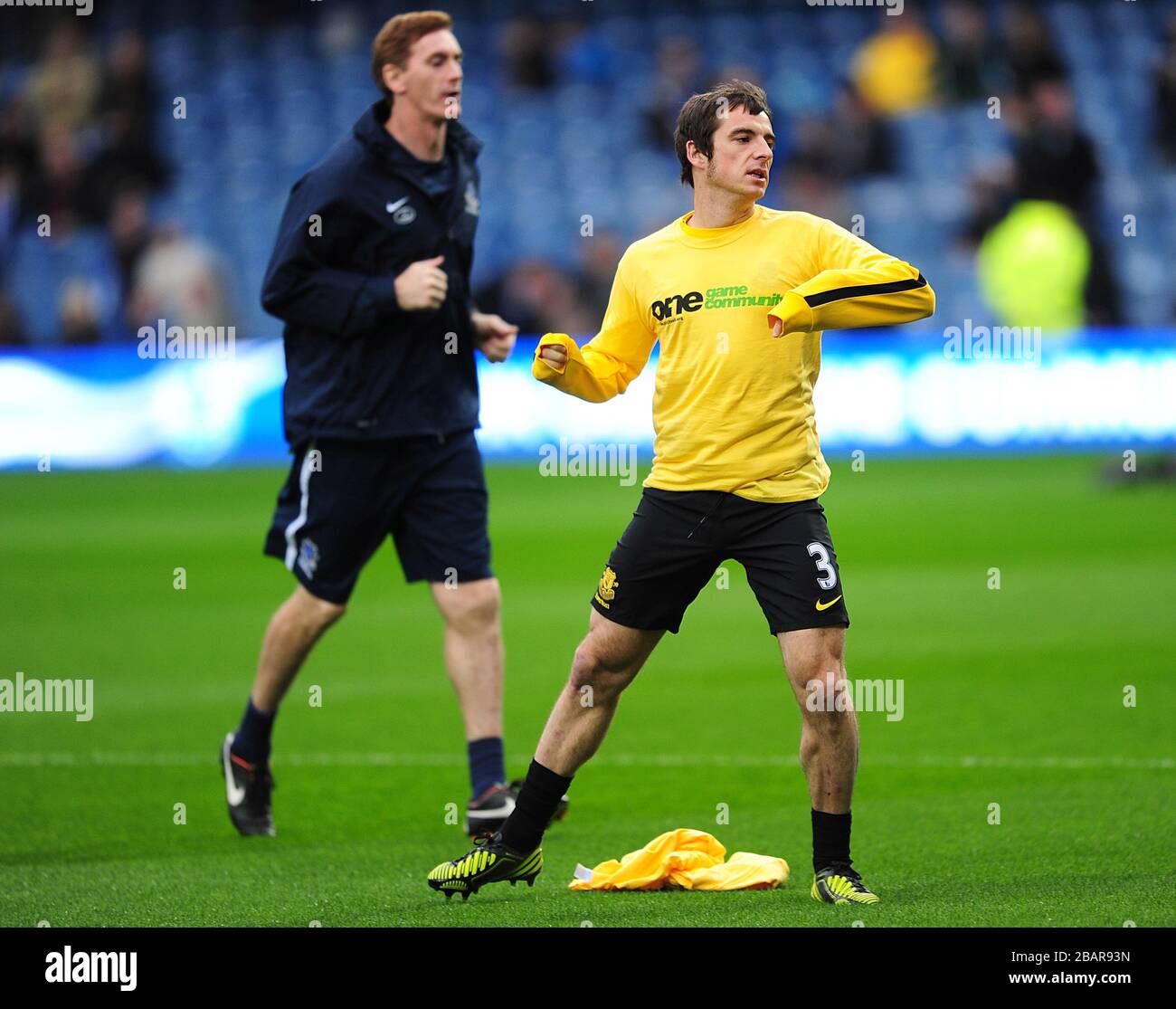 Everton's Leighton Baines (right) and head fitness coach Dave Billows during warm-up Stock Photo