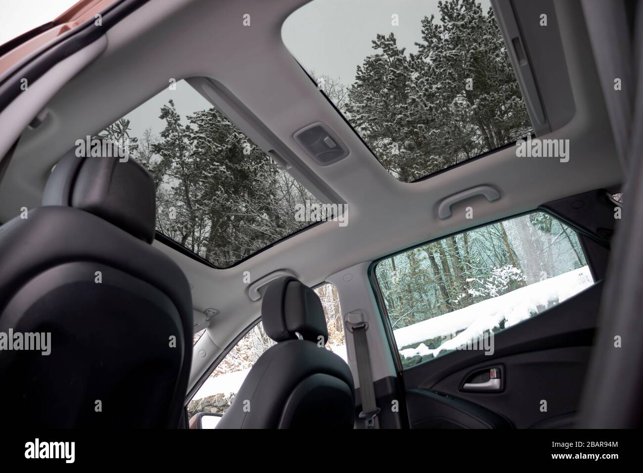Panoramic view inside car double sunroof hatch with tinted glass