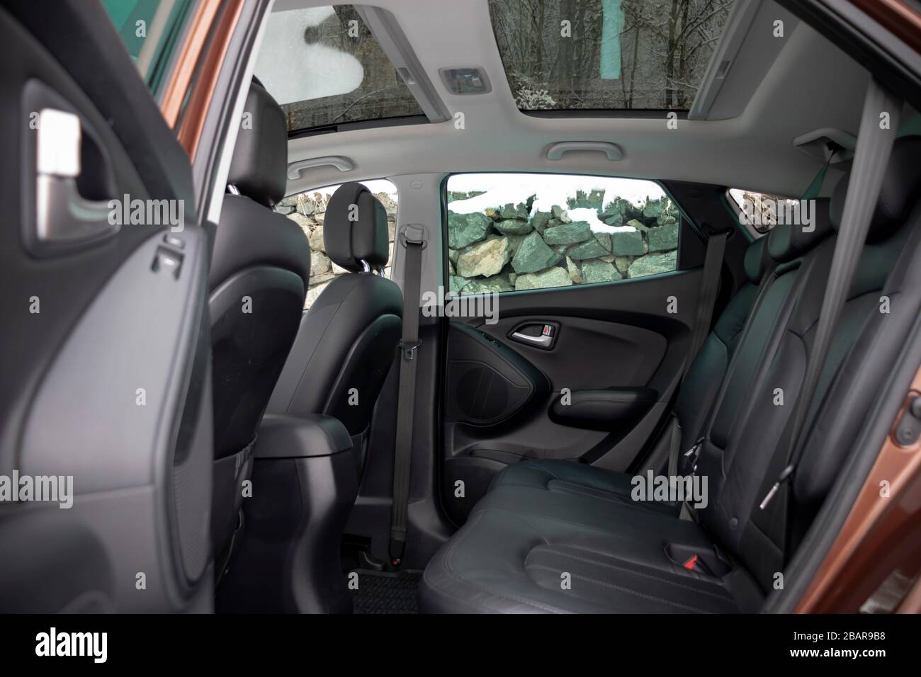 Panoramic view inside car double sunroof hatch with tinted glass. Sliding panoramic sunroof