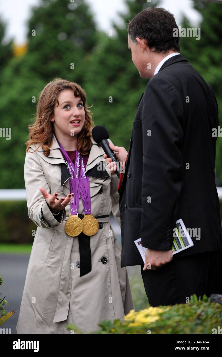 Paralympic double gold medal winner Natasha Baker is interviewed at Kempton Racecourse Stock Photo