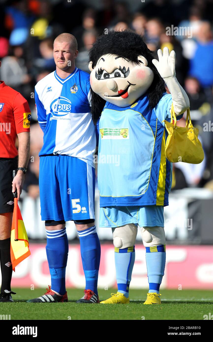Bristol Rovers' captain Garry Kenneth (l) with the Burton Albion mascot Stock Photo