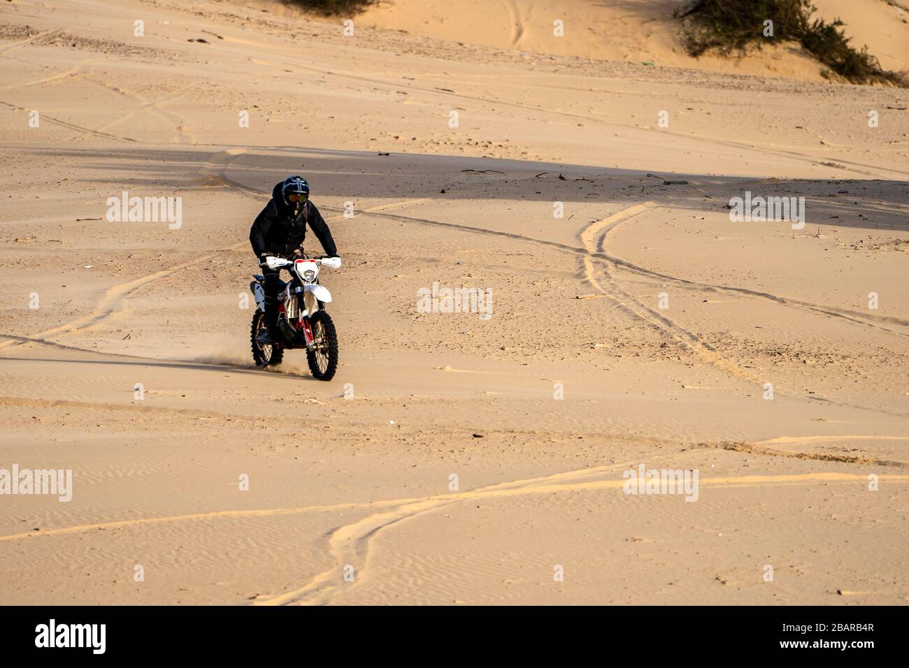 Dirt bike on a sand dune Stock Photo Alamy