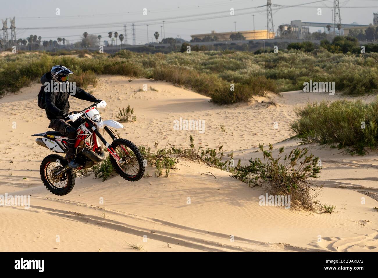Dirt bike on a sand dune Stock Photo Alamy