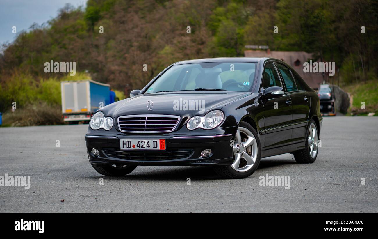 Mercedes Benz C Class, model W203 - year 2004, Avantgarde equipment, AMG  Alloy wheels, driver side corner with steered wheels, vented disc brakes,  18 Stock Photo - Alamy