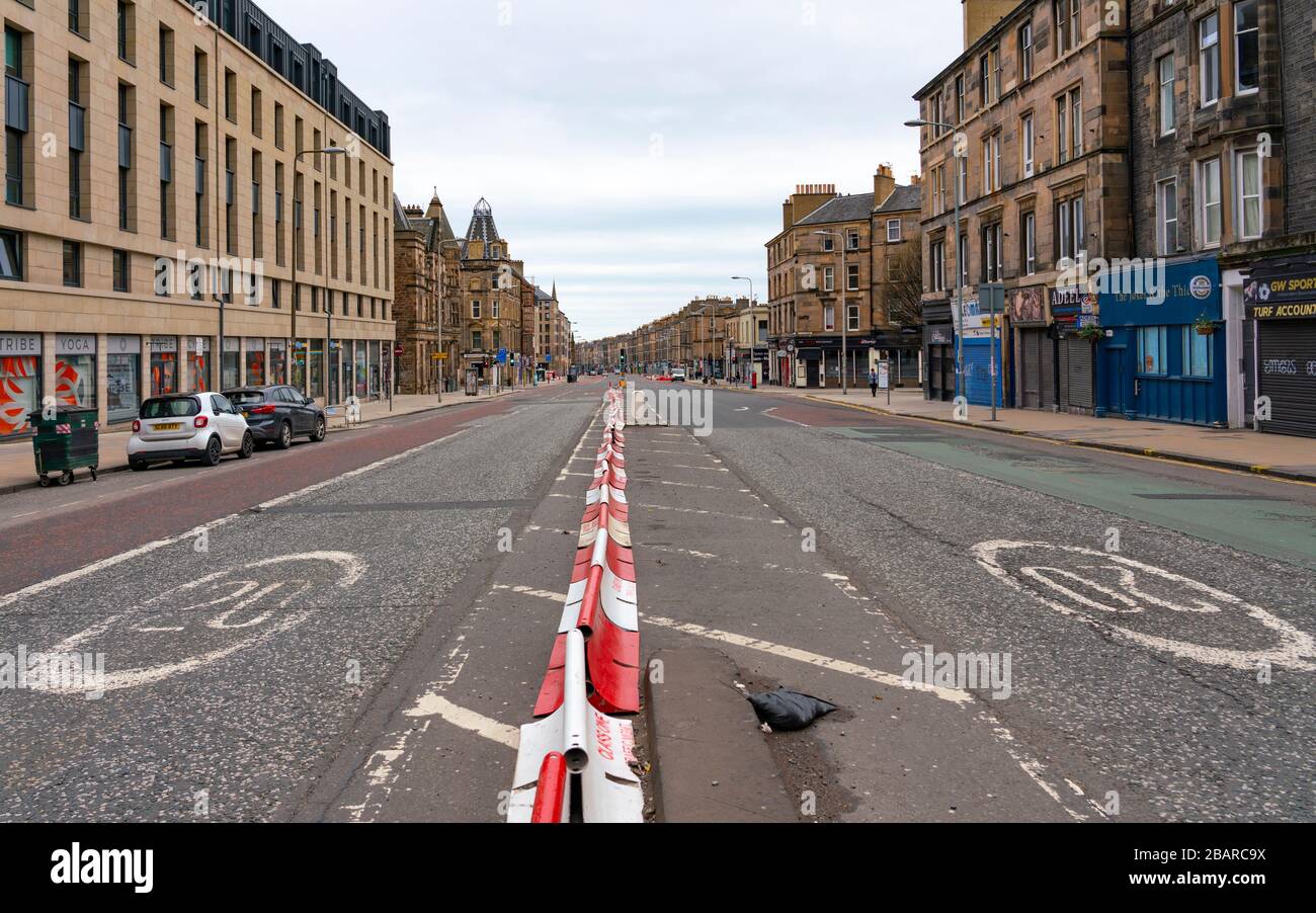 Edinburgh, Scotland, UK. 29 March, 2020. Life in Edinburgh on the first Sunday of the Coronavirus lockdown. Streets deserted, shops and restaurants closed, very little traffic on streets and reduced public transport. Pictured; Leith Walk. Iain Masterton/Alamy Live News Stock Photo