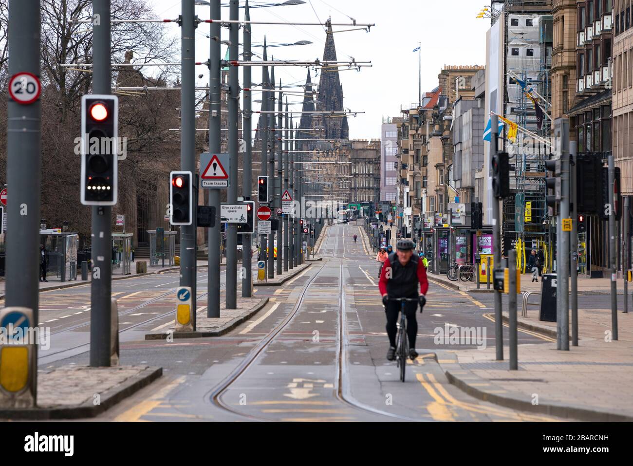 Edinburgh, Scotland, UK. 29 March, 2020. Life in Edinburgh on the first Sunday of the Coronavirus lockdown. Streets deserted, shops and restaurants closed, very little traffic on streets and reduced public transport. Pictured; Princes Street mostly empty. Iain Masterton/Alamy Live News Stock Photo