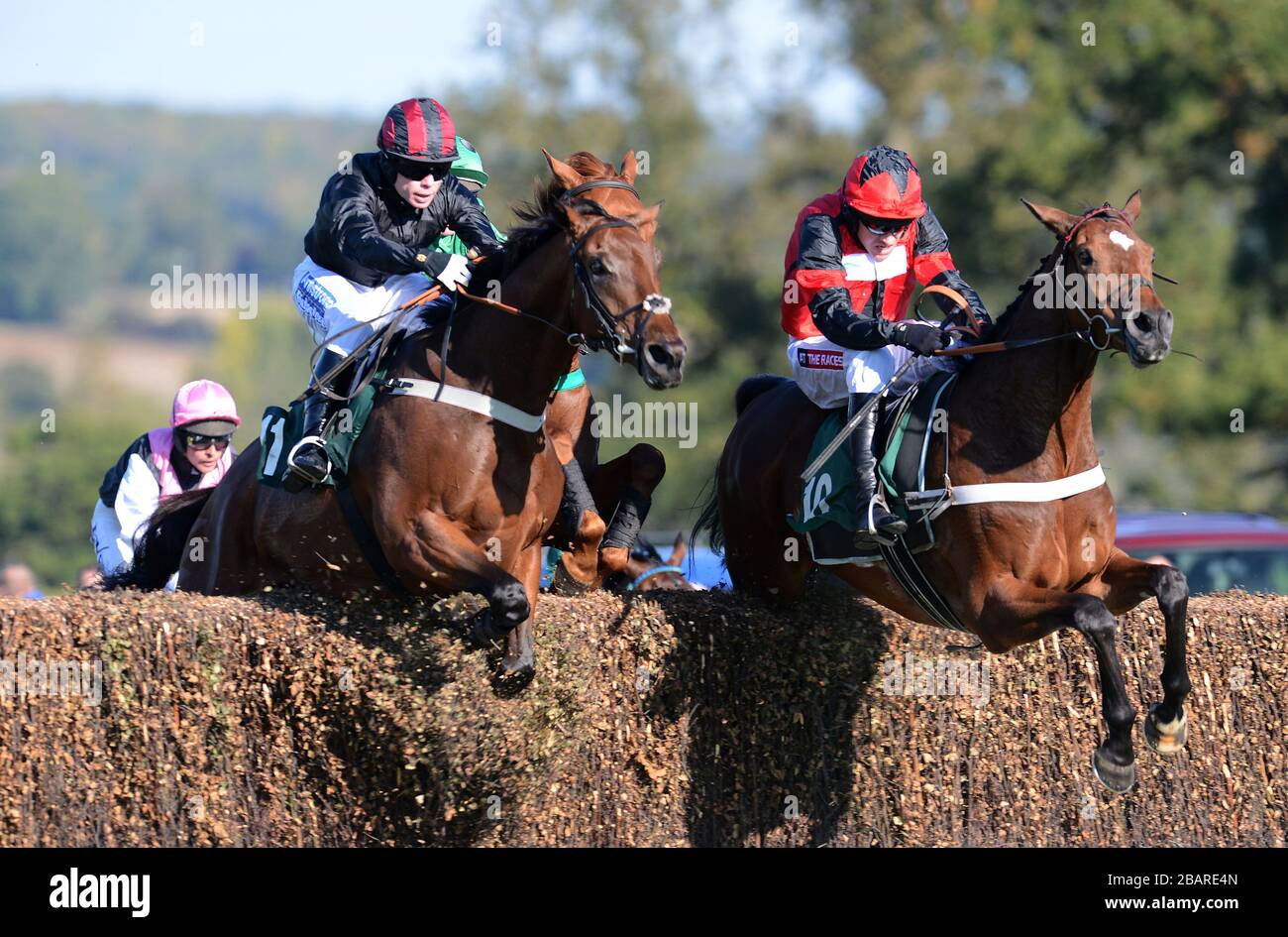 Creekside ridden by Denis O'Regan (left) winners of the Linden Homes Greens Norton Beginners' Chase from Thanks For Coming ridden by Barry Geraghty (right) Stock Photo