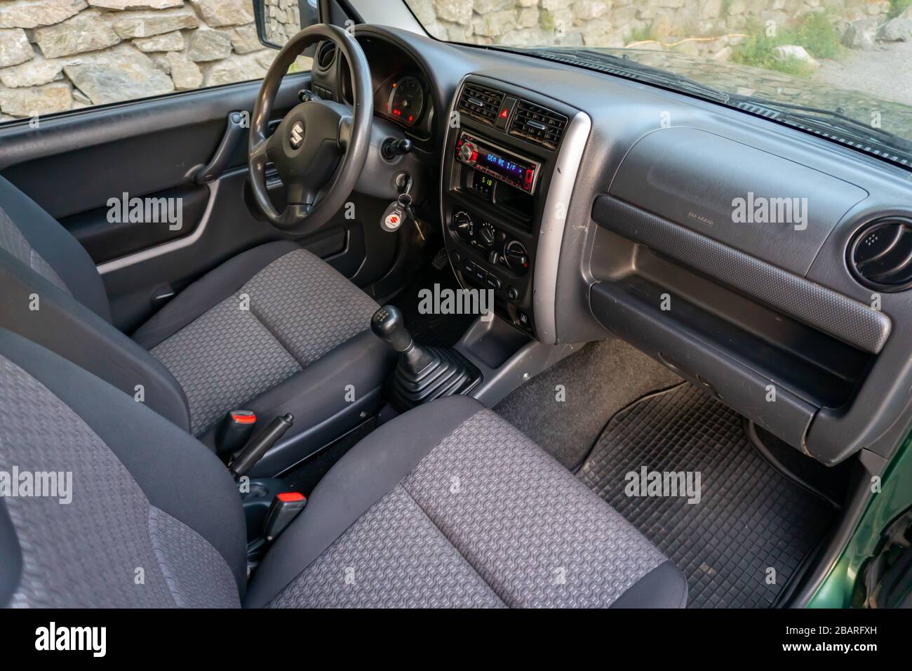 Cluj-Napoca,Cluj/Romania-08.29.2019-Suzuki Jimny 4 wheel drive detailed interior photo. Wide lens, folded back seats Stock Photo