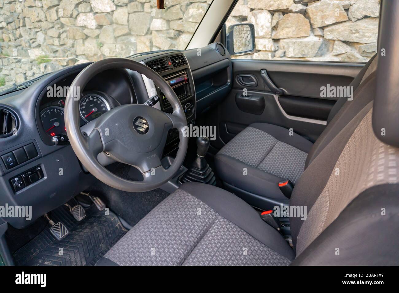 Cluj-Napoca,Cluj/Romania-08.29.2019-Suzuki Jimny 4 wheel drive detailed interior photo. Wide lens, folded back seats Stock Photo