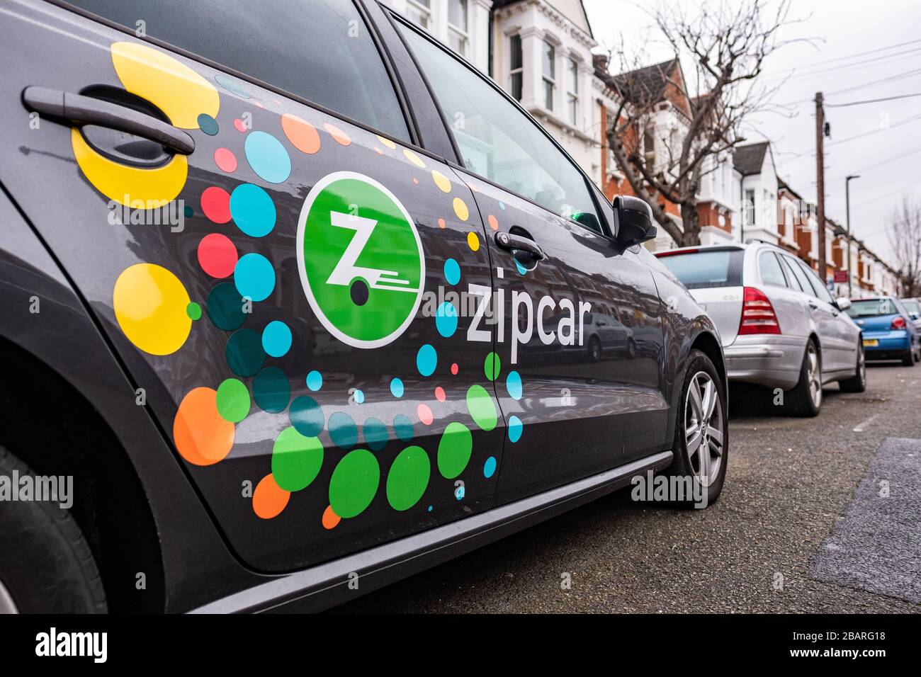 Zipcar - an American car-sharing company and a subsidiary of Avis Budget Group Stock Photo