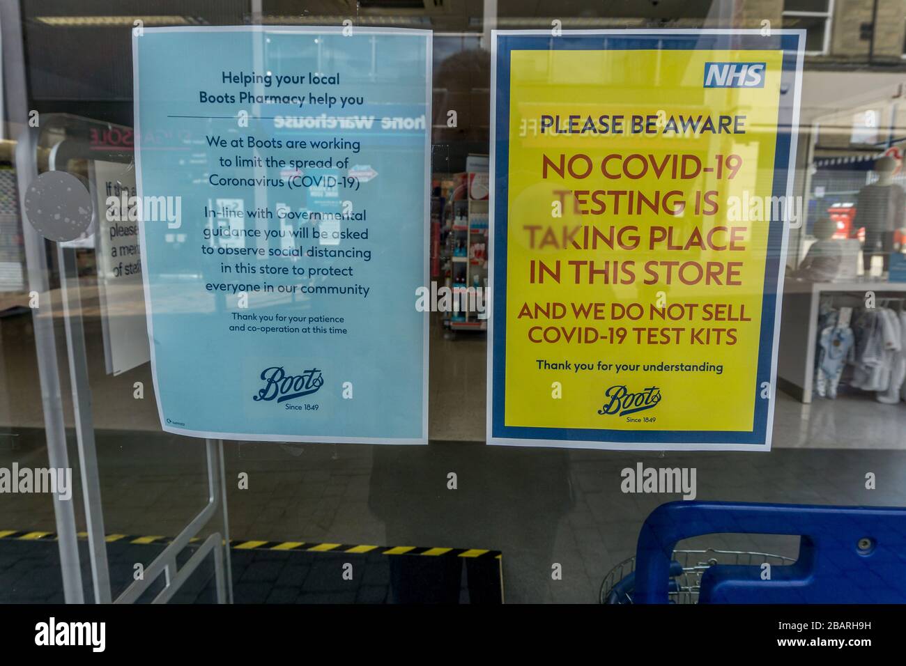 Covid 9 and coronovirus testing and warning signs, Boots, Huddersfield on Saturday morning 28th March 2020 during the lockdown due to the corono virus pandemic. Stock Photo