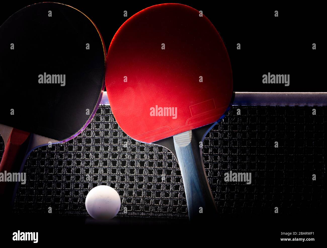 Two Table Tennis Rackets Two table tennis rackets and balls on a blue table with net Stock Photo ...