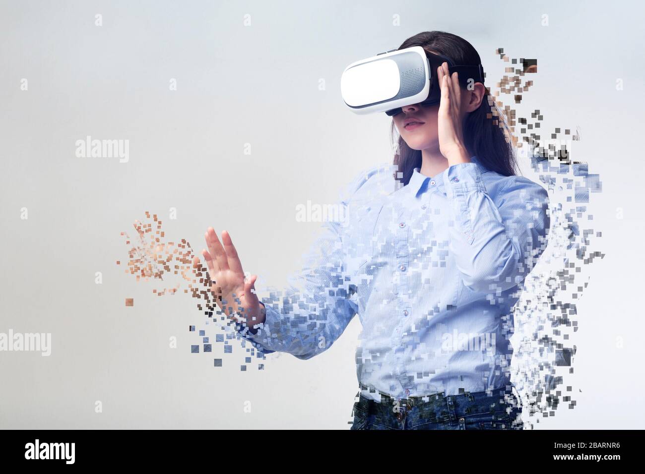 Collage with woman in VR headset falling apart into pixels on light  background, empty space Stock Photo - Alamy