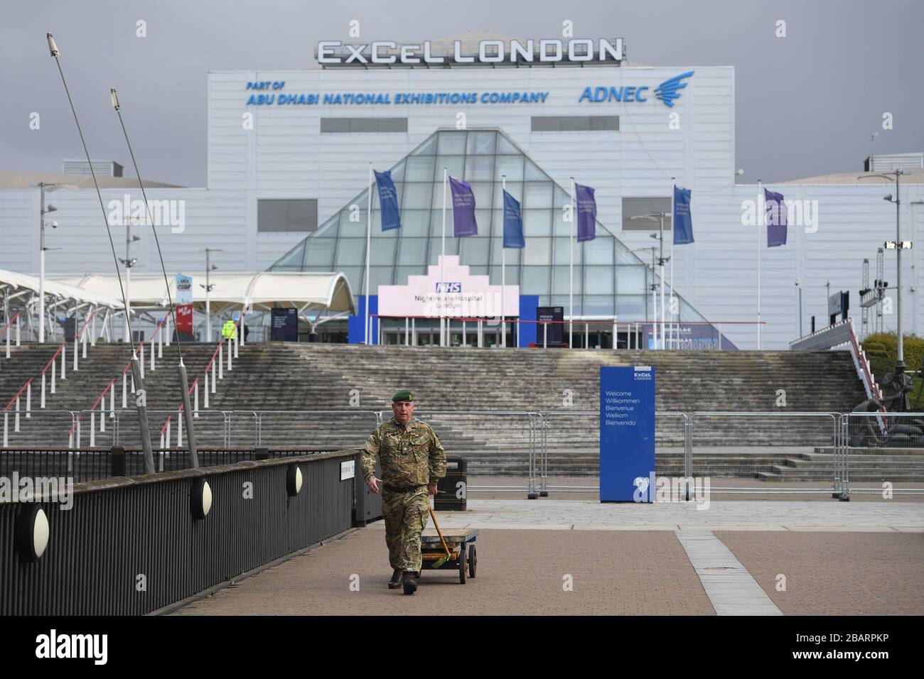 Military personnel at the ExCel centre in London which is being made into a temporary hospital - the NHS Nightingale Hospital - comprising of two wards, each of 2,000 people, to help tackle coronavirus. Stock Photo