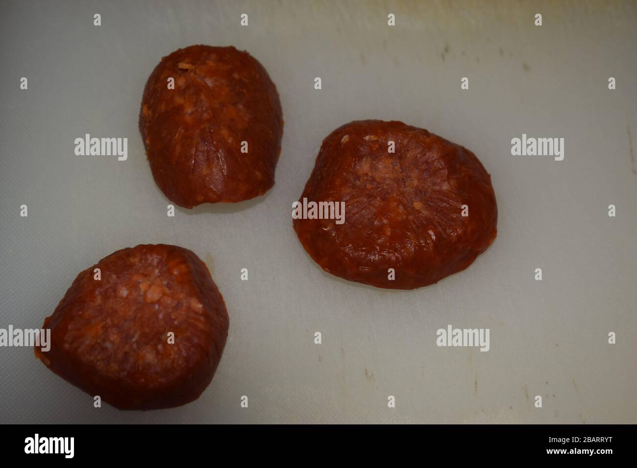 red hot pepperoni salami pieces Stock Photo Alamy