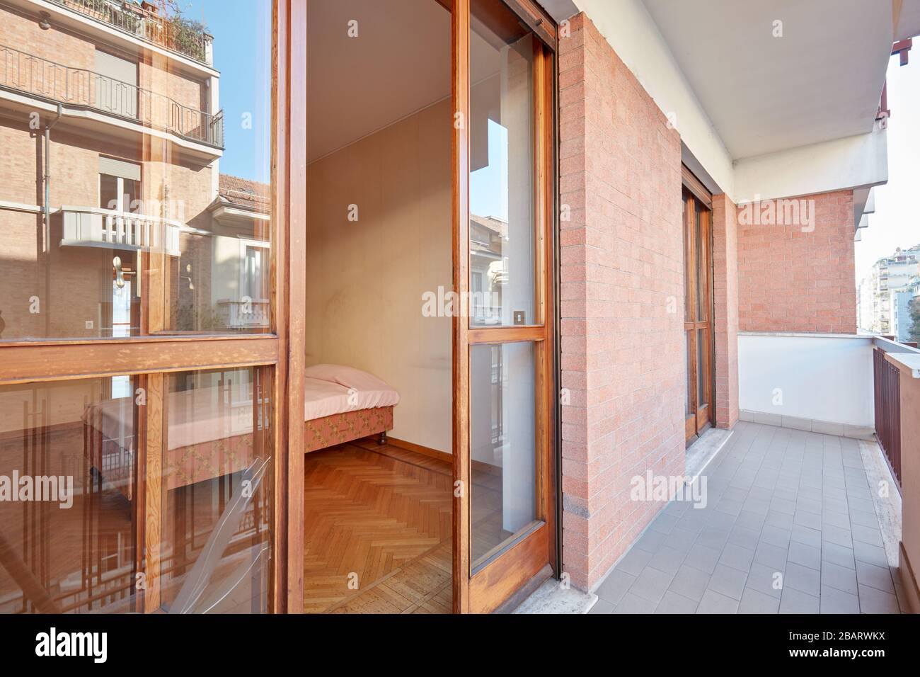 Balcony and bedroom interior view in a sunny day Stock Photo