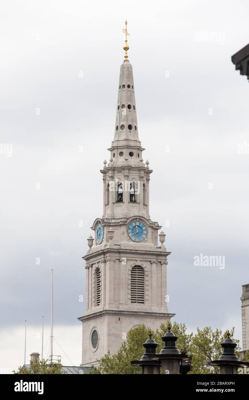 Spire of St. Martin-in-the-fields on Trafalgar Square: The spire with its blue clock faces of this famous London Church. Stock Photo