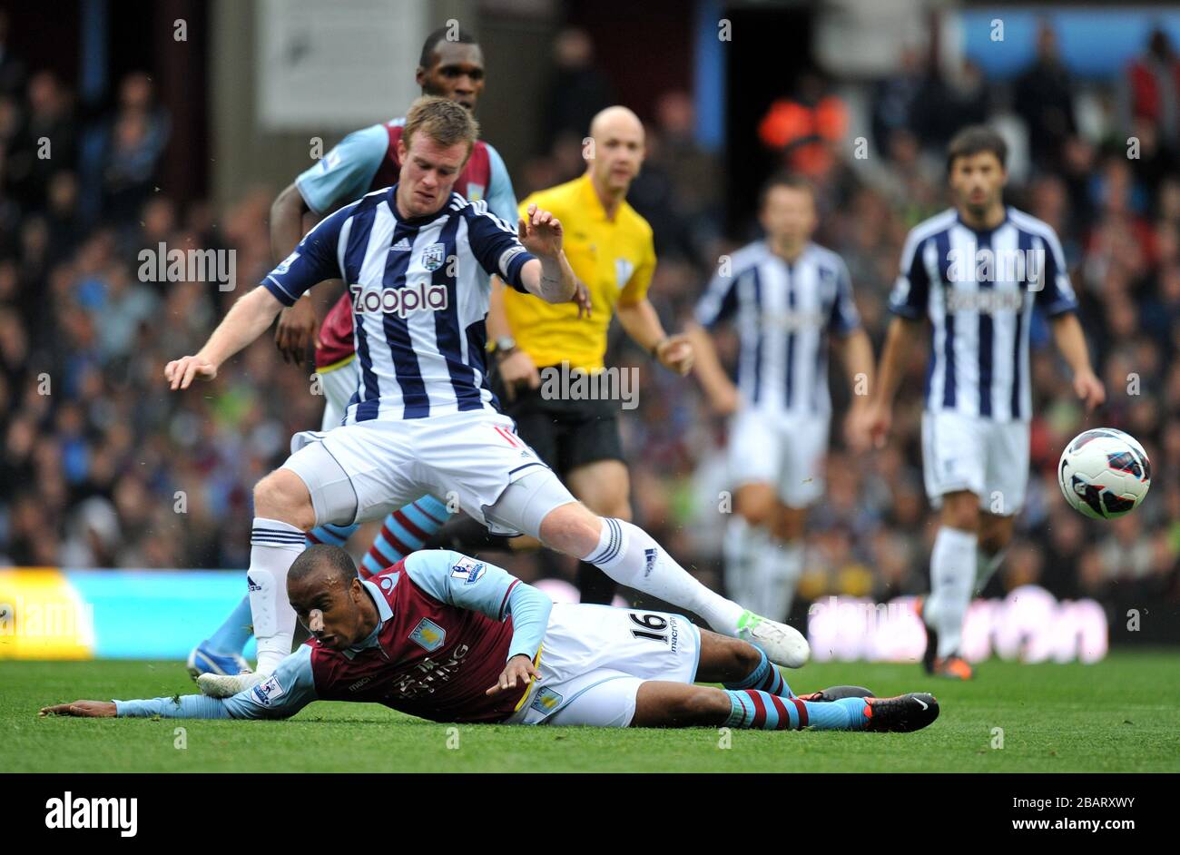 Aston Villa's Fabian Delph slides in on West Bromwich Albion's Chris ...