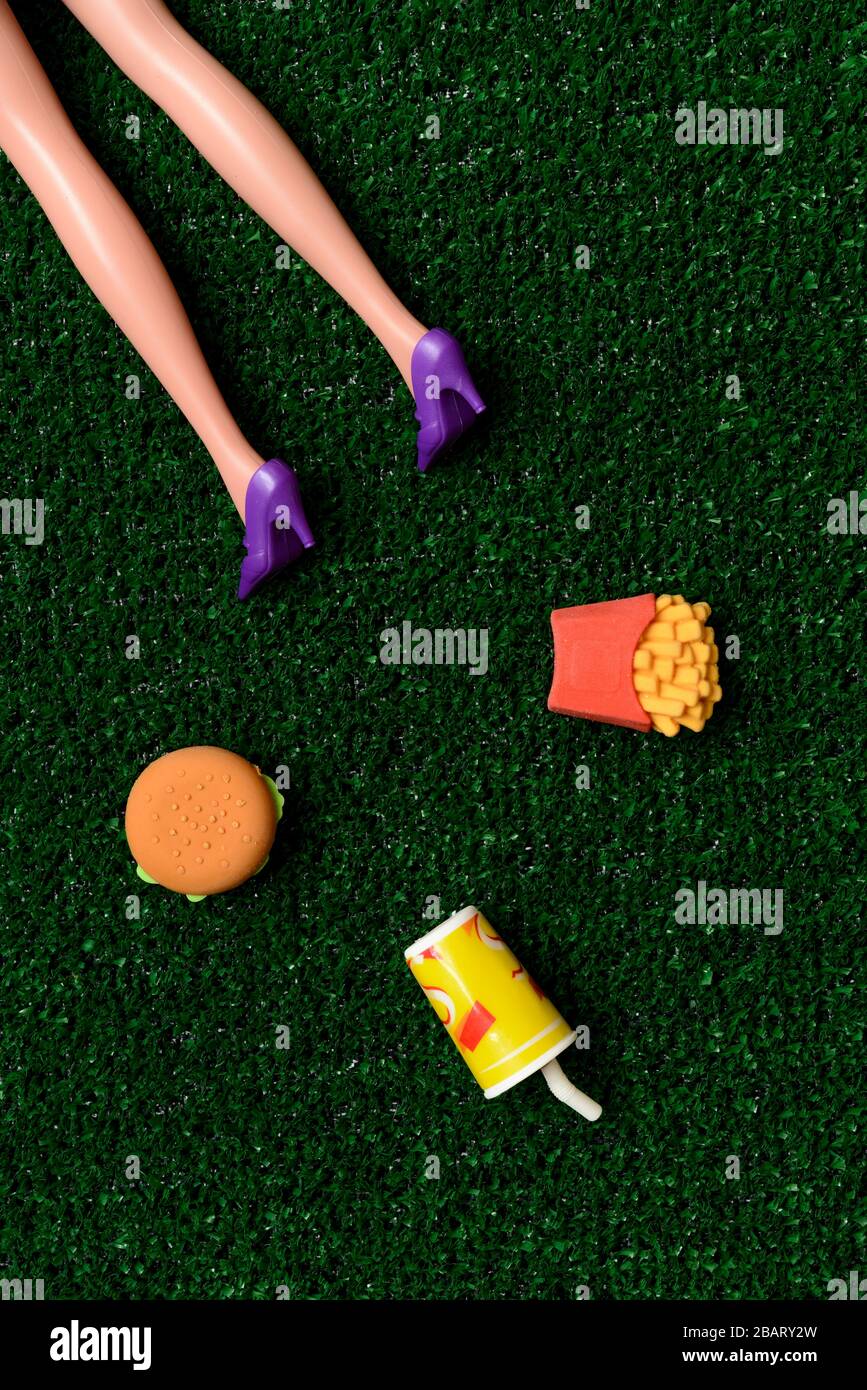 Body of woman on the ground near fast food Stock Photo