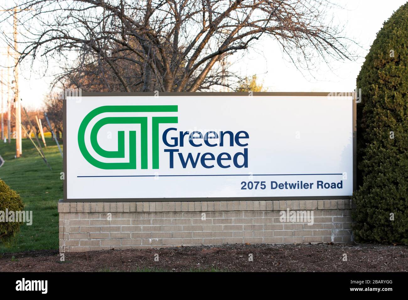 A logo sign outside of the headquarters of Greene, Tweed & Co., Inc., in Kulpsville, Pennsylvania, on March 23, 2020. Stock Photo