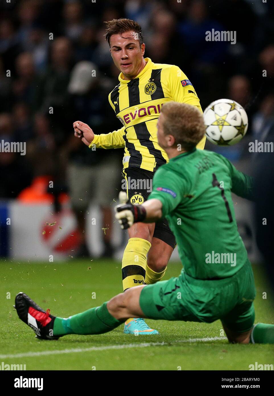 Manchester City's Joe Hart saves from Borussia Dortmund's Mario Gotze Stock Photo