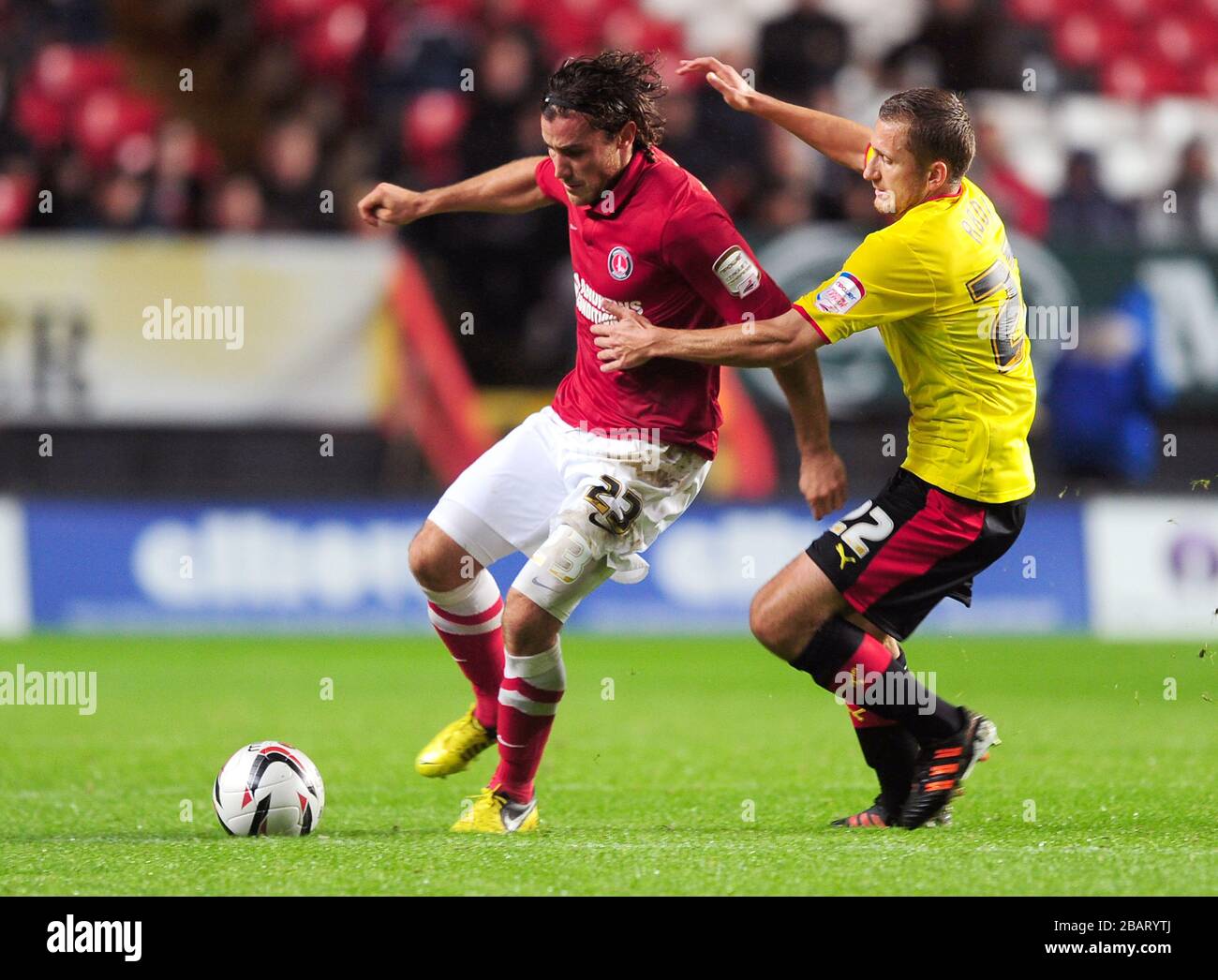Charlton Athletic's Lawrie Wilson (l) and Watford's Almen Abdi (r) battle for the ball Stock Photo