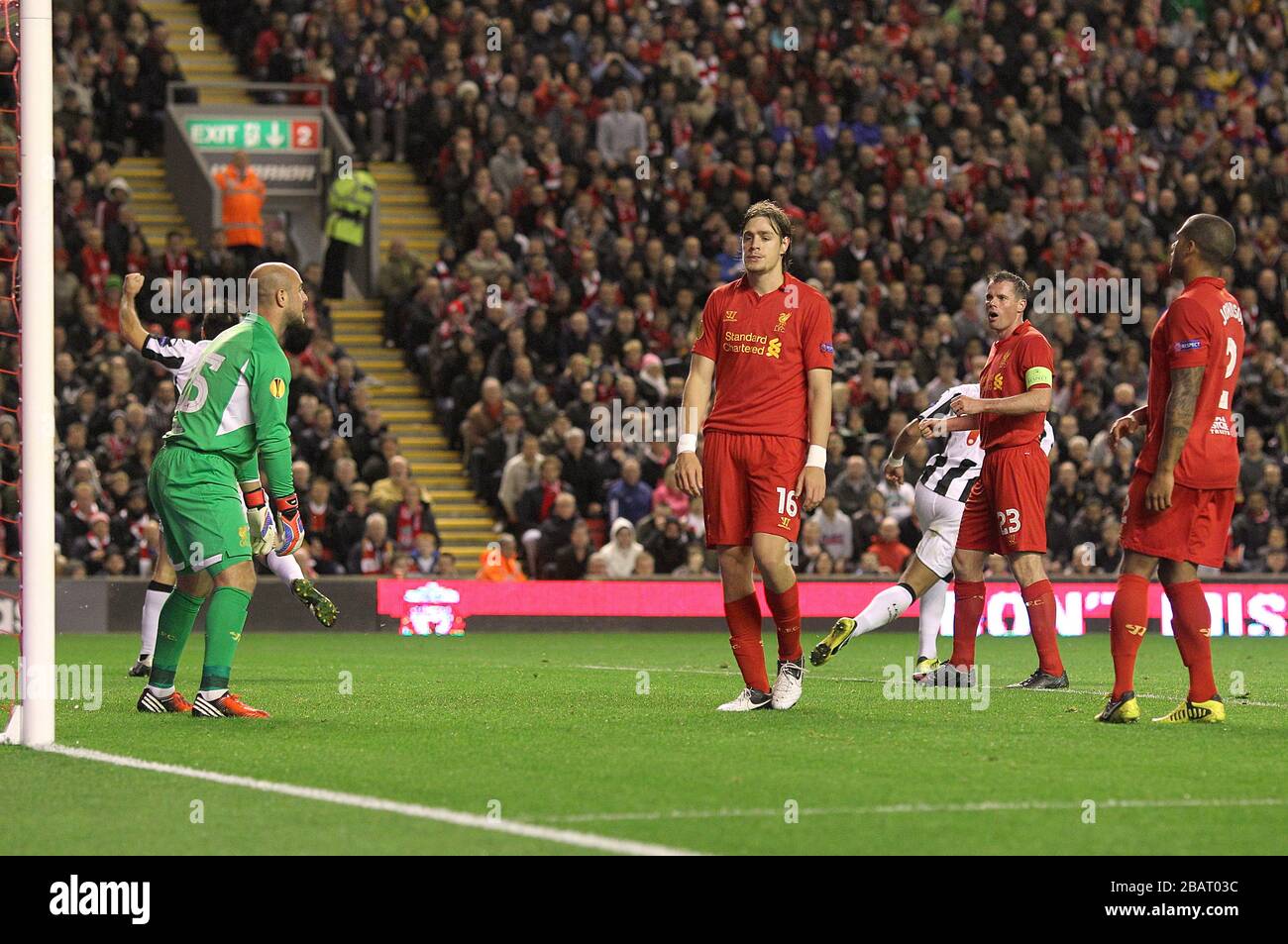 Liverpool's Sebastian Coates (centre) stands dejected alongside team-mates after scoring an own goal, Udinese's second of the night Stock Photo