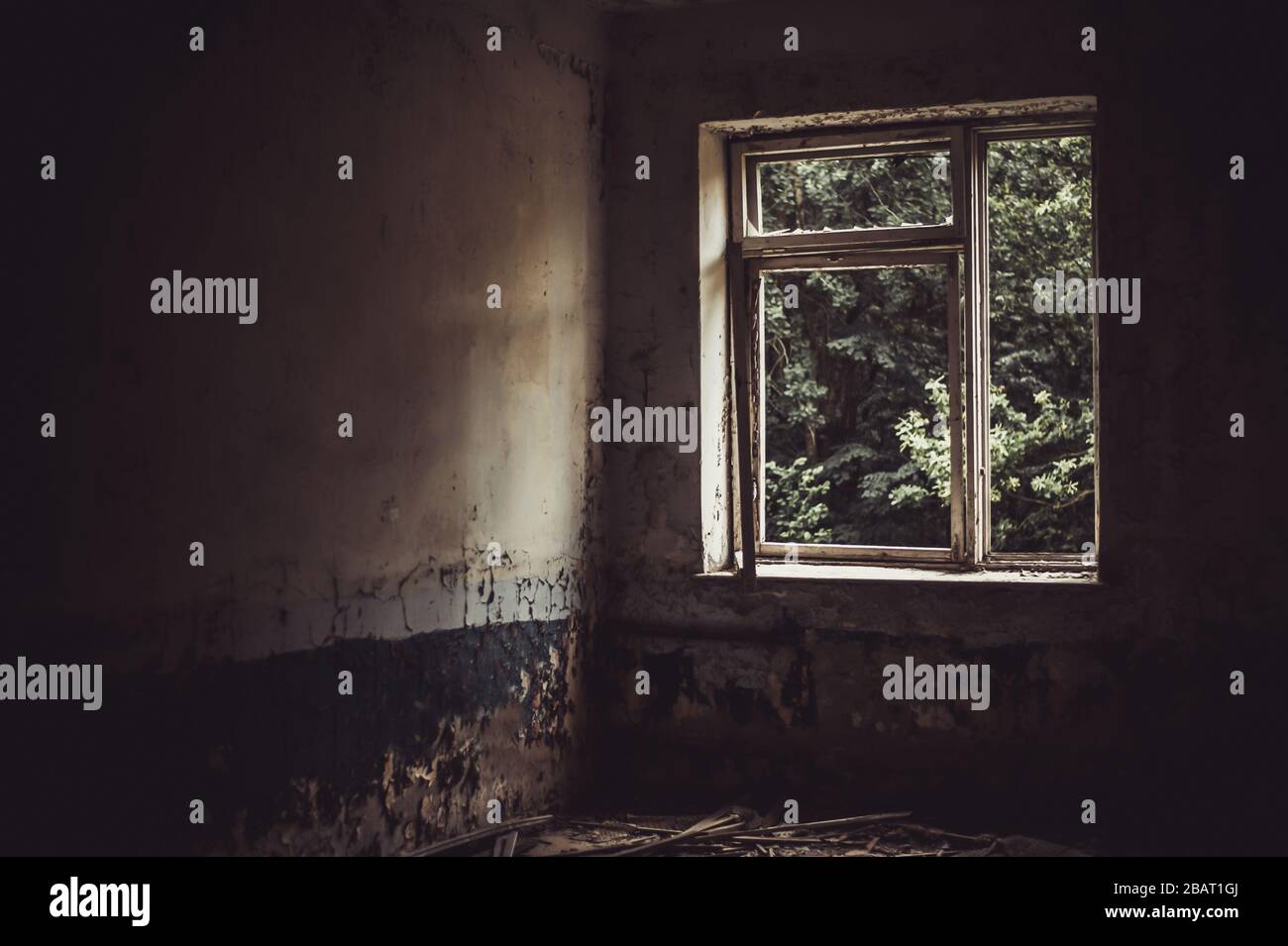 Defocus horror halloween background. Dark room in an abandoned ruined  building. Light from a window with broken glass Stock Photo - Alamy