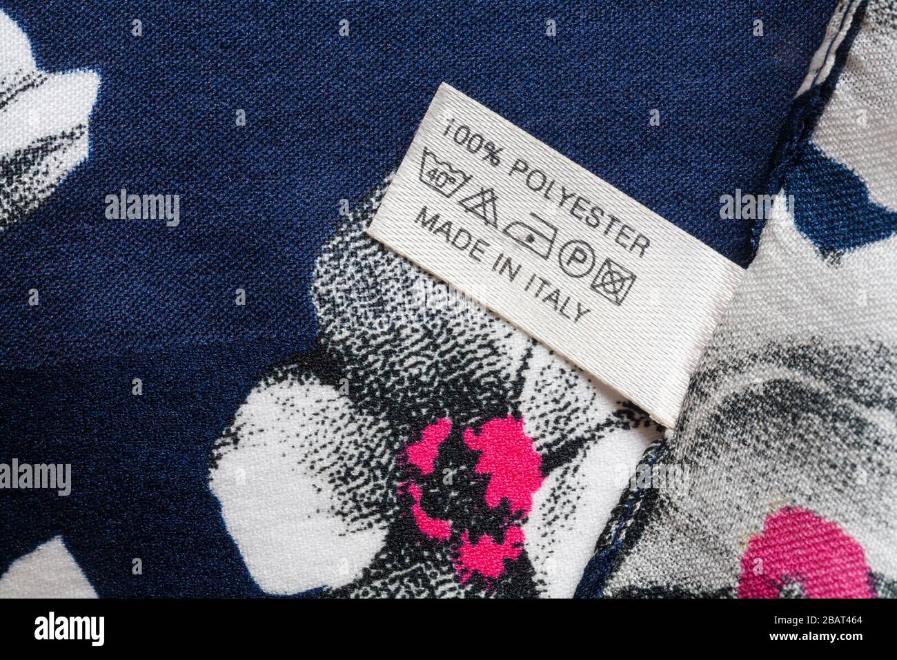 Label in woman's 100% polyester scarf made in Italy with care wash symbols - sold in the UK United Kingdom, Great Britain Stock Photo