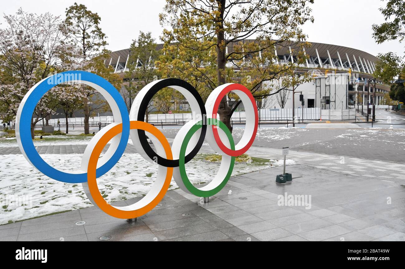 Tokyo, Japan. 29th Mar, 2020. The Olympic rings are seen near the National Stadium in Tokyo, Japan on Sunday, March 29, 2020. It's first time in 32 years that Tokyo witnessed the accumulation of snow measuring 1 centimeter or more in late March. Photo by Keizo Mori/UPI Credit: UPI/Alamy Live News Stock Photo