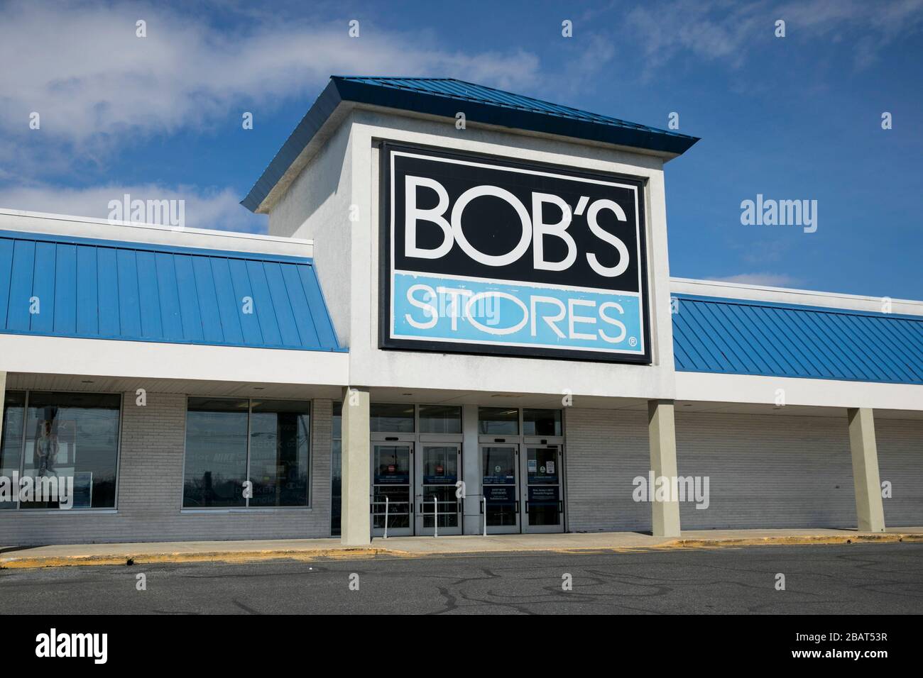 A logo sign outside of a Bob's Stores retail store location in Totowa