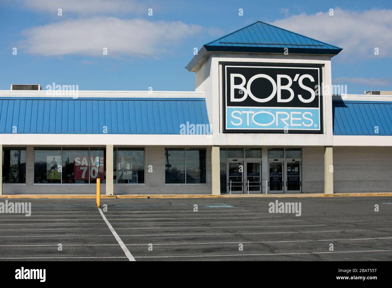 A logo sign outside of a Bob's Stores retail store location in Totowa