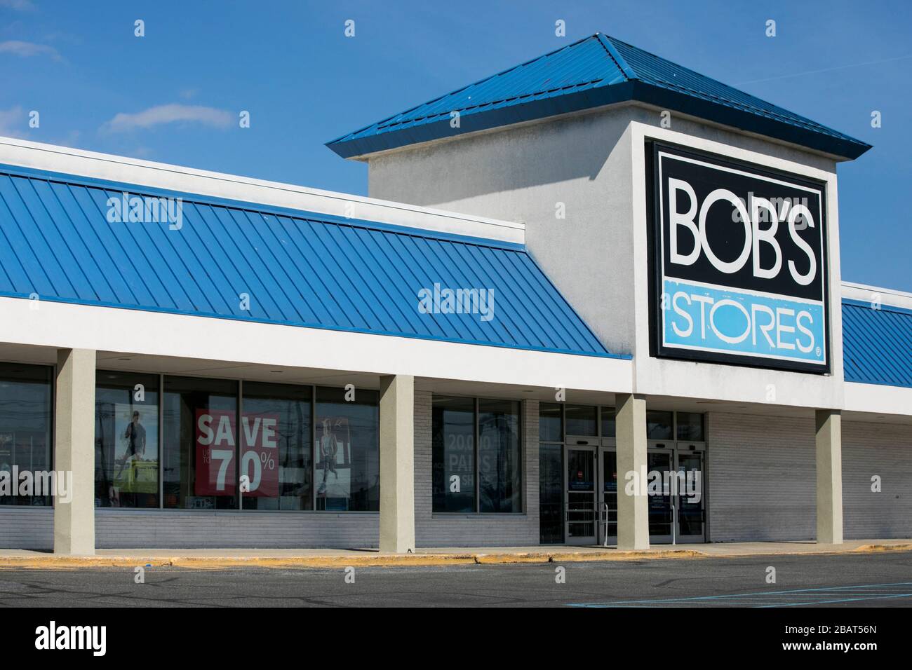 A logo sign outside of a Bob's Stores retail store location in Totowa