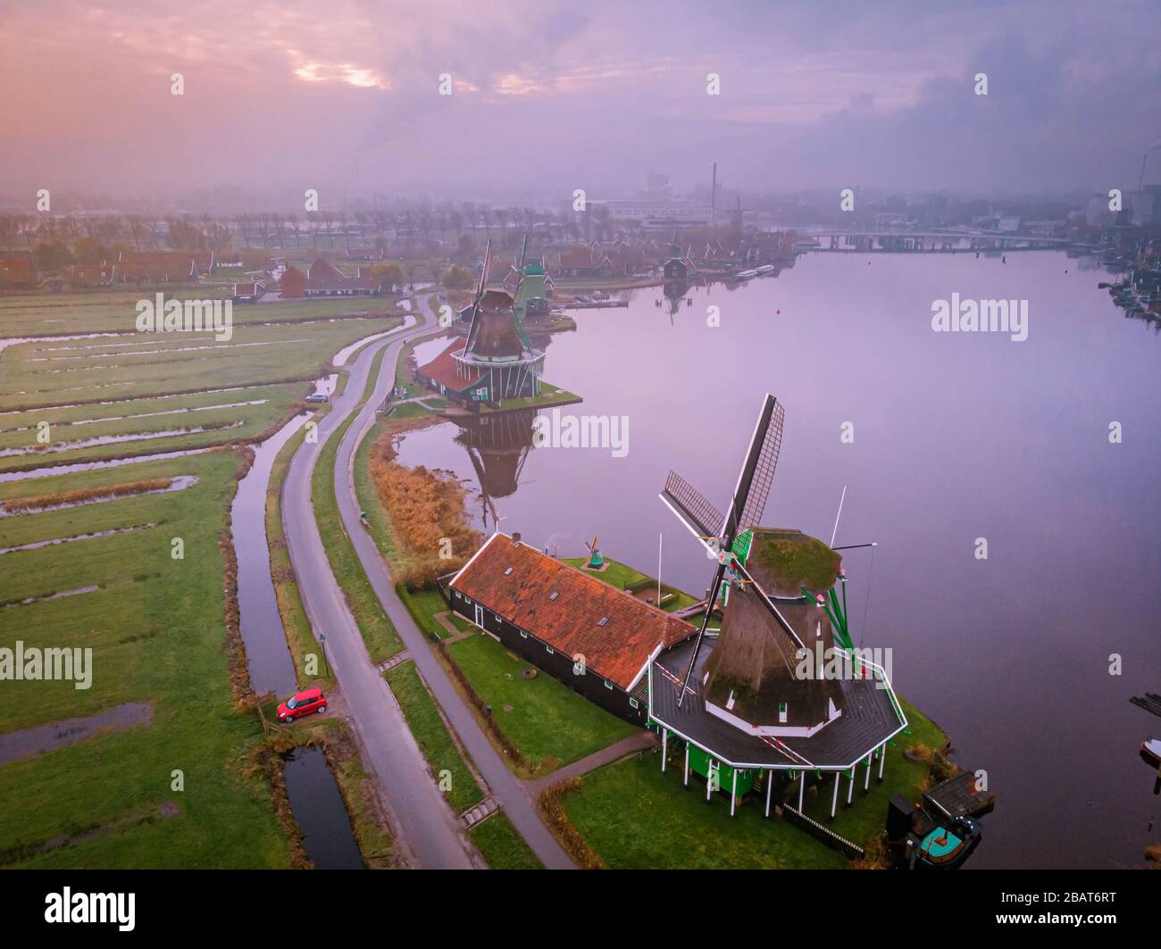 zaanse-schans-netherlands-a-dutch-windmill-village-during-sunset-whit