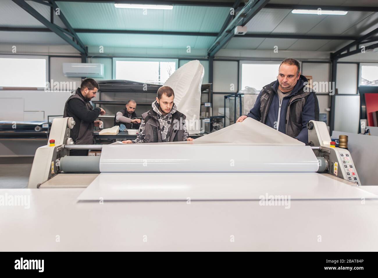 Large group of worker printmaker technician operator works in digital