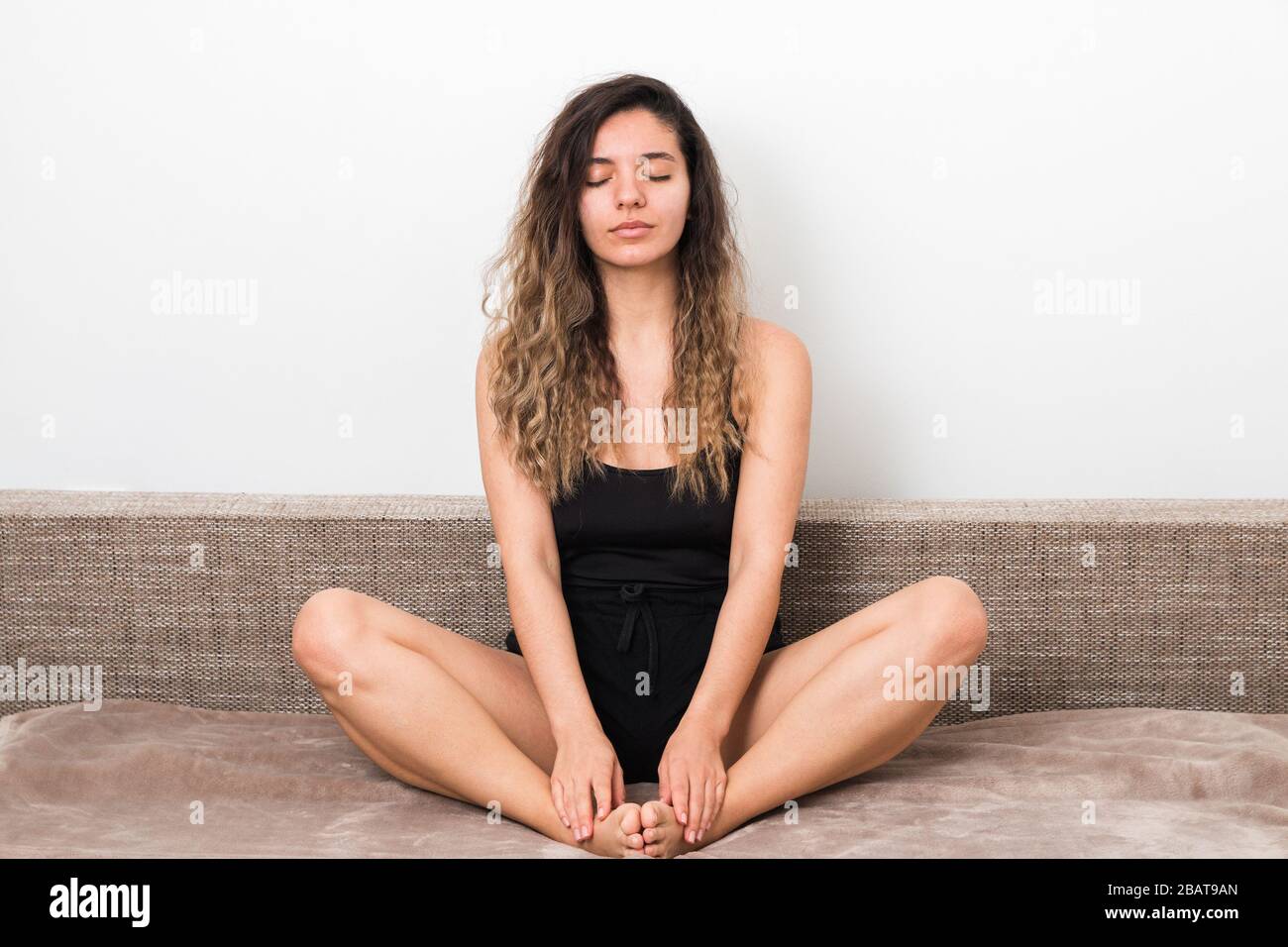 releasing all bad energy from news. young woman with curly hairs 