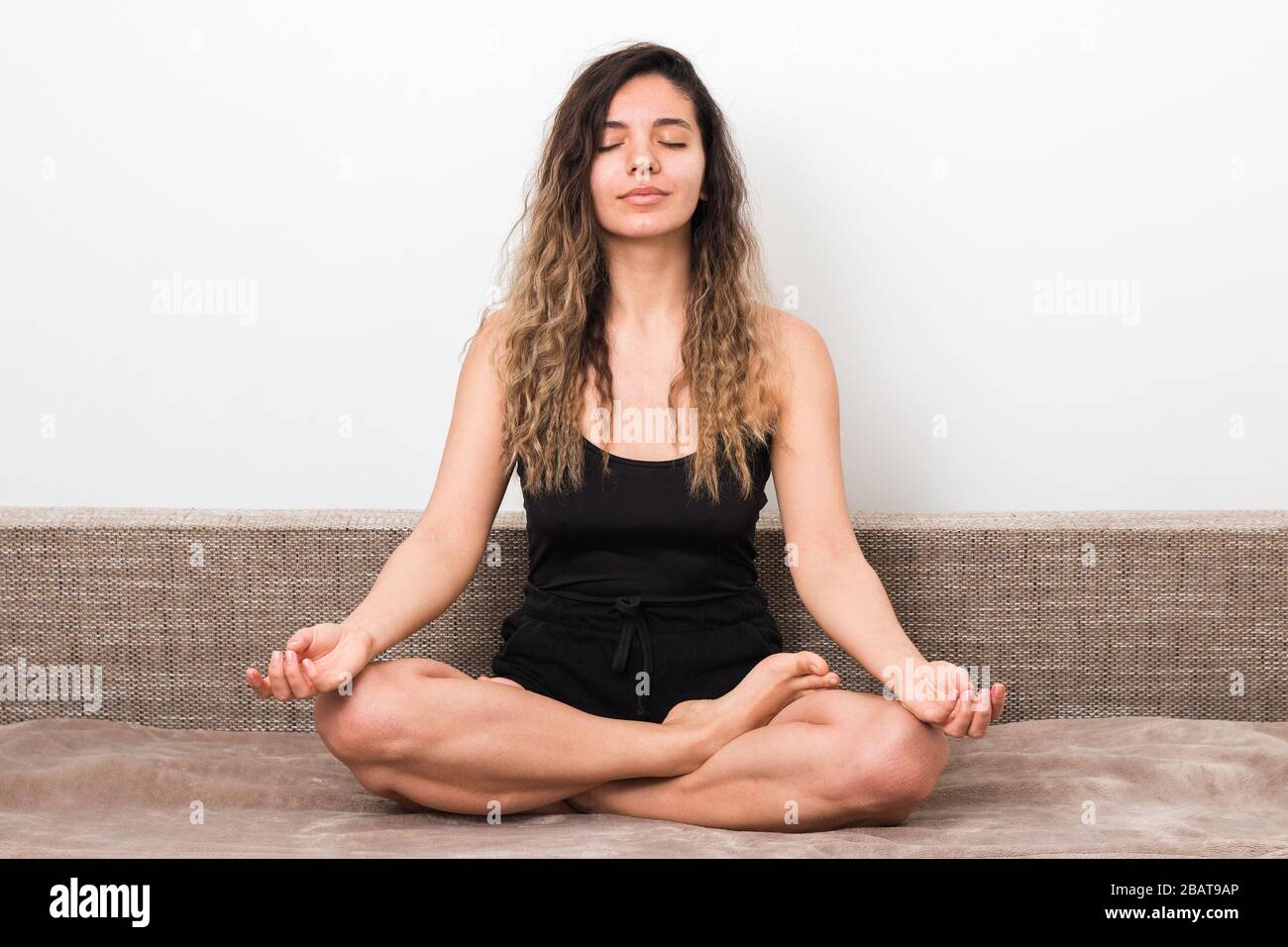 releasing all bad energy from news. young woman with curly hairs 