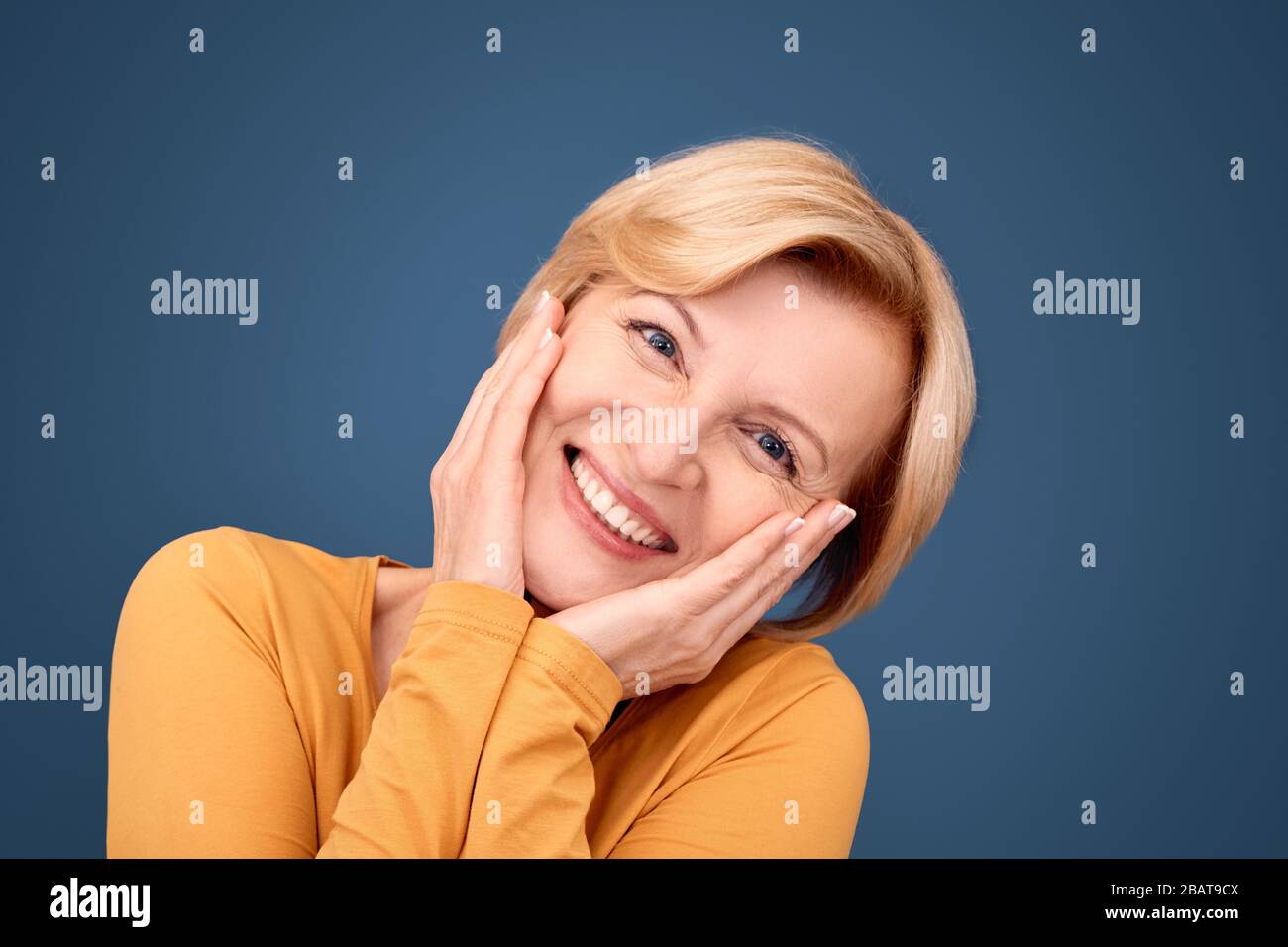 Middle aged woman smiling nice, looking at camera Stock Photo