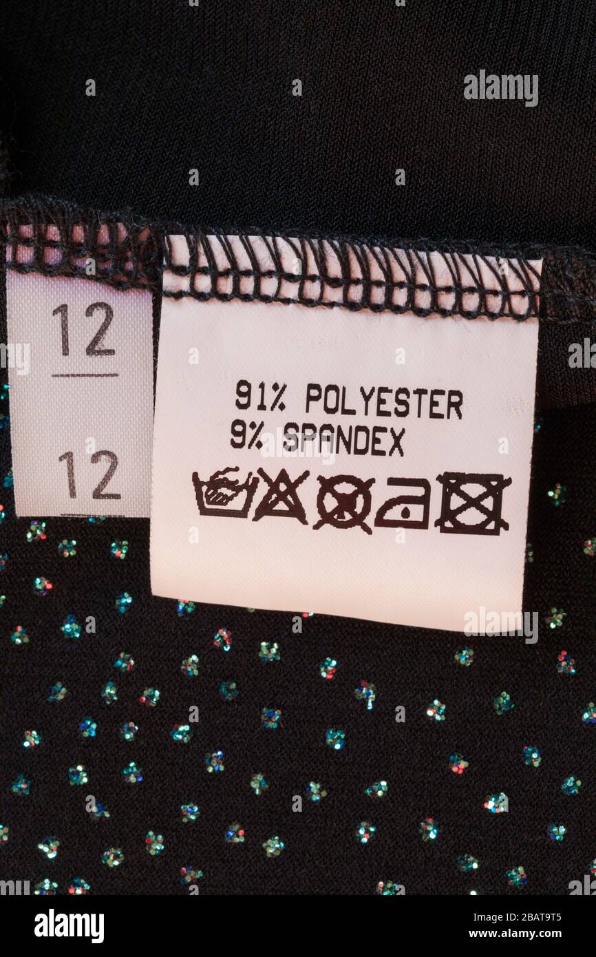 label - 91% polyester 9% spandex with wash care symbols label in woman's clothing size 12 Stock Photo